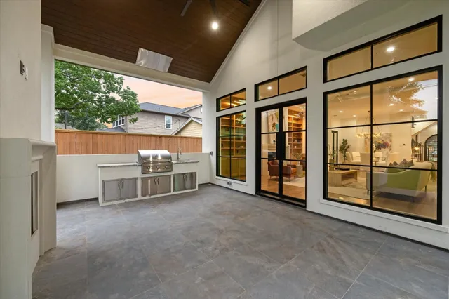 a view of a porch with furniture and garden