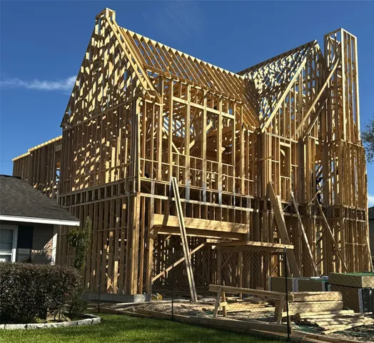 a large kitchen with a table and chairs