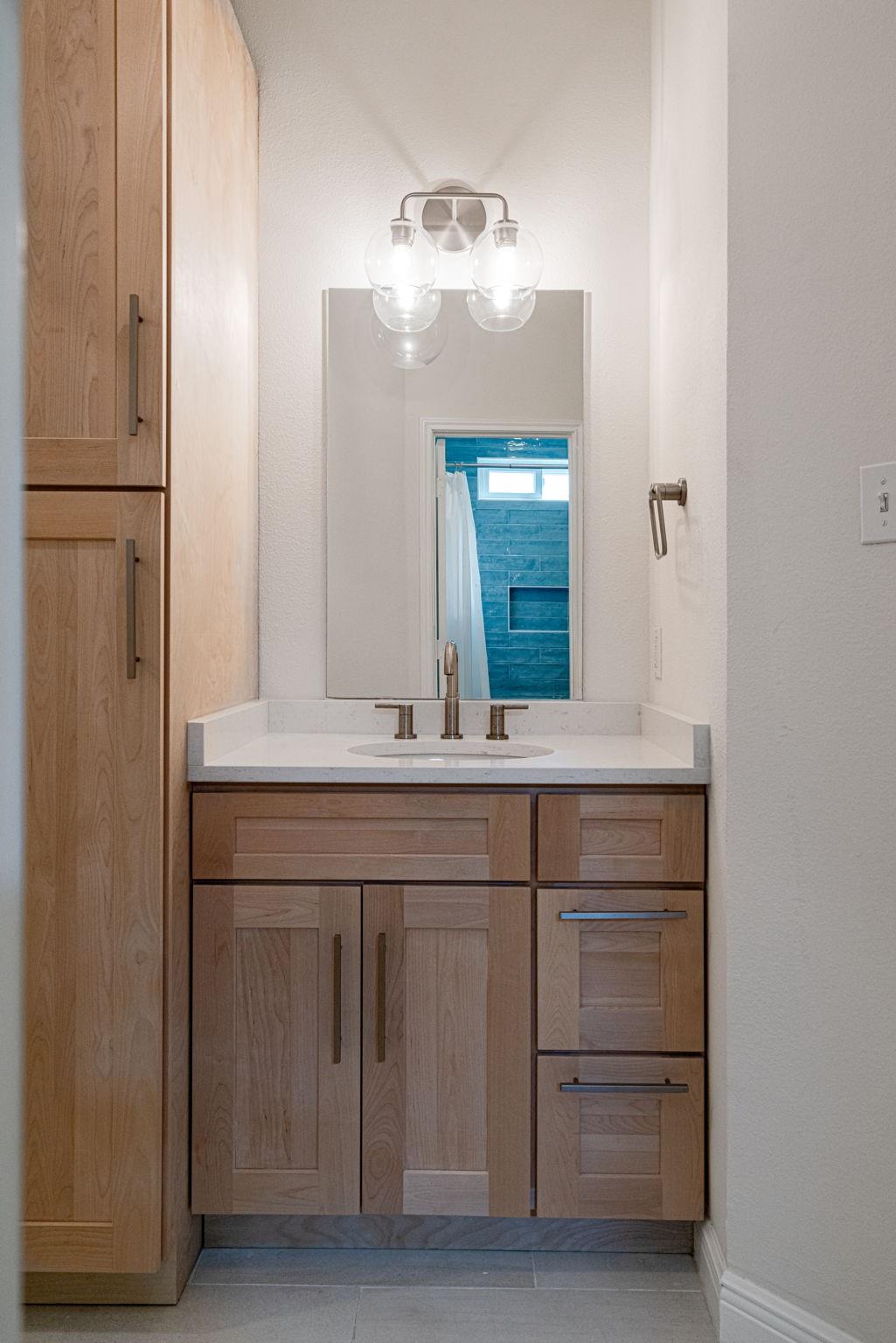 72 San Saba Street Austin, TX 78702 - Photo 14 of 23 Full bathroom with vanity and light tile patterned floors