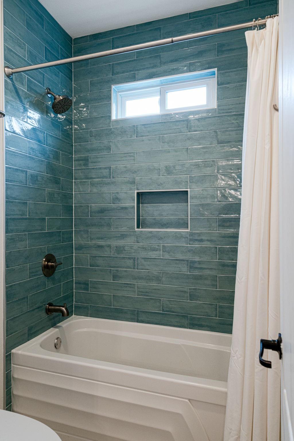 72 San Saba Street Austin, TX 78702 - Photo 15 of 23 Bathroom featuring shower / bath combo and toilet