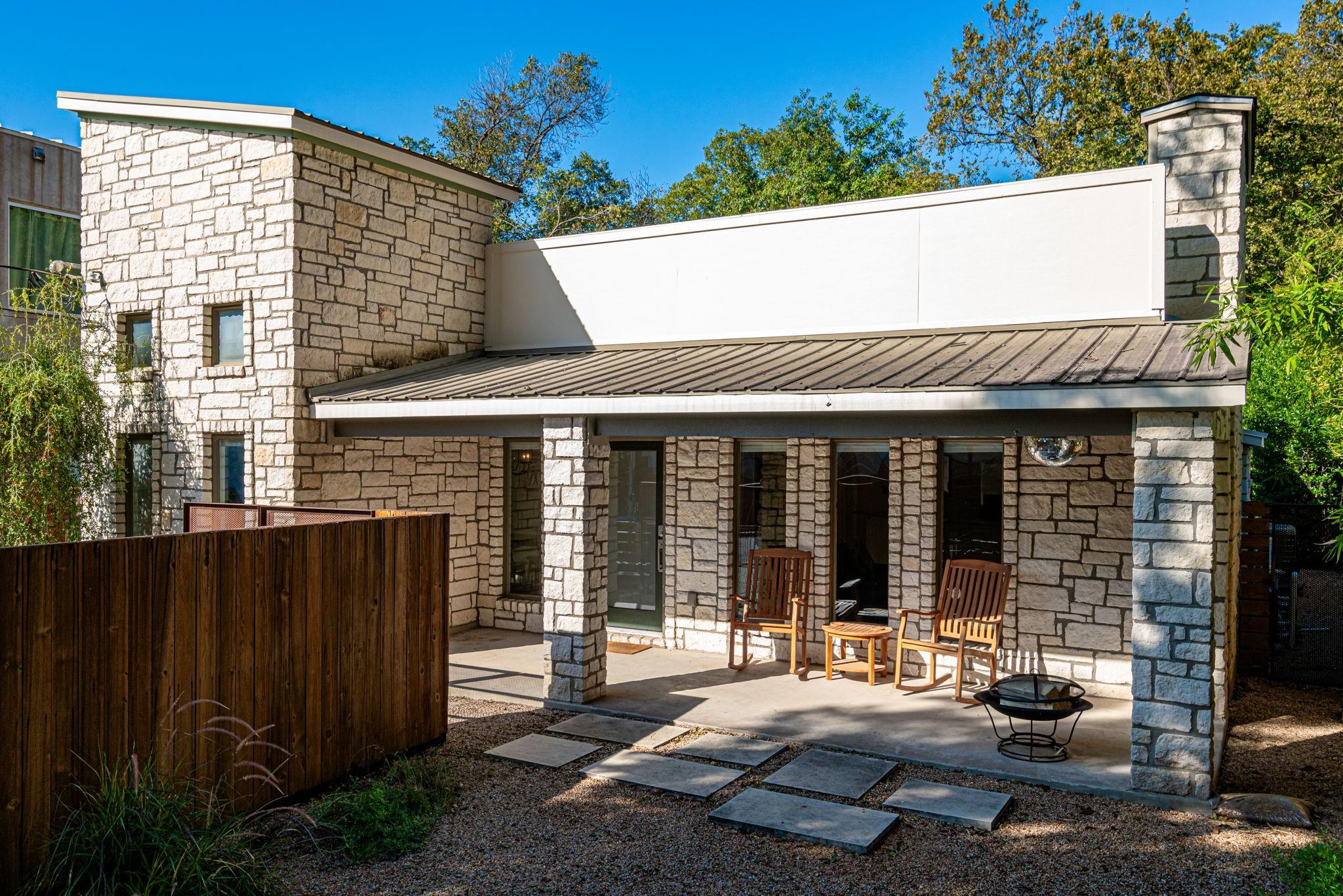 72 San Saba Street Austin, TX 78702 - Photo 2 of 23 Featuring stone siding, a patio, and a standing seam roof