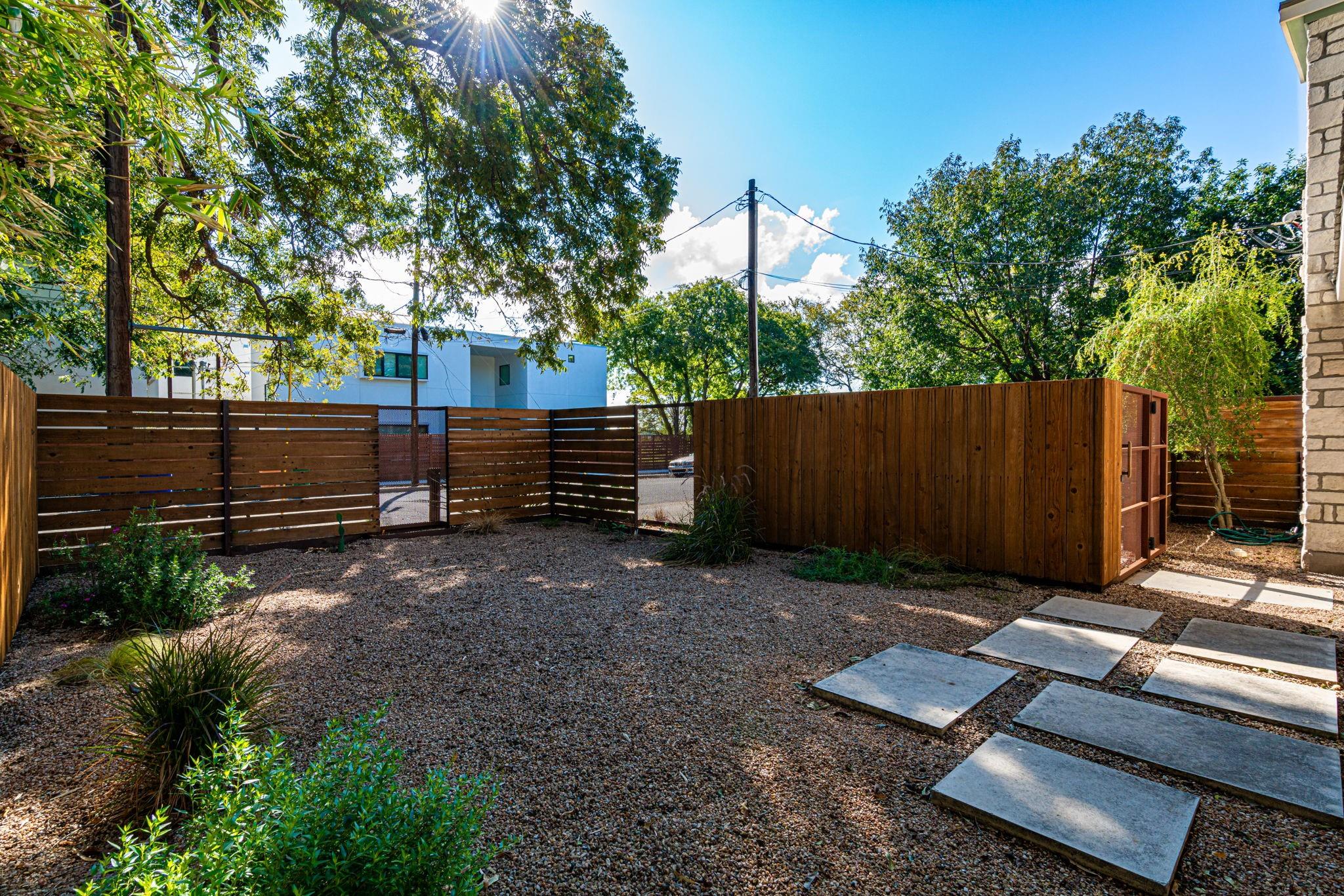 72 San Saba Street Austin, TX 78702 - Photo 3 of 23 Fenced yard featuring a gate