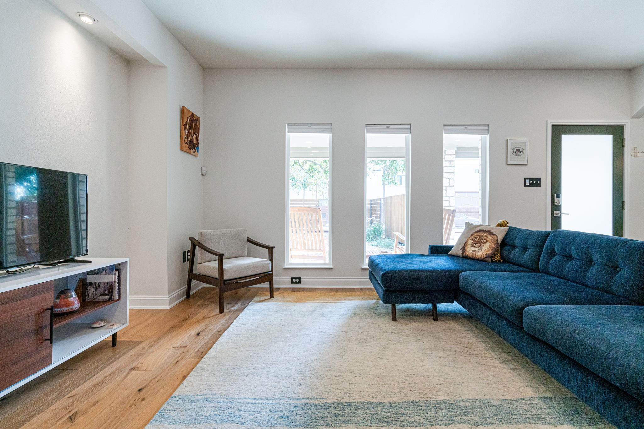 72 San Saba Street Austin, TX 78702 - Photo 4 of 23 Living area with light wood-style floors and baseboards