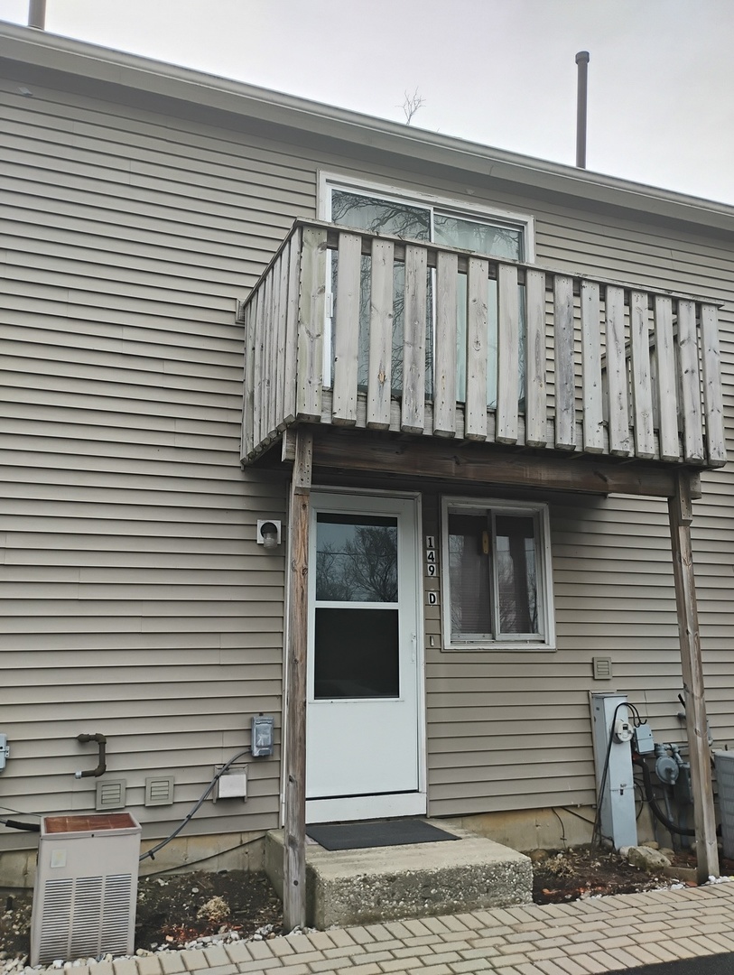 149 Forest Avenue, Unit D Fox Lake, IL 60020 - Photo 4 of 5 a view of a house with wooden deck