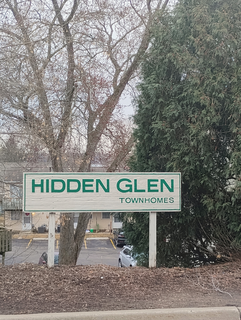 149 Forest Avenue, Unit D Fox Lake, IL 60020 - Photo 2 of 5 a sign that is on a pole