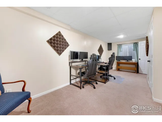 a view of a workspace with furniture