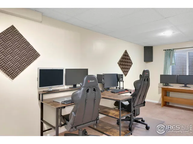 a view of a workspace with furniture