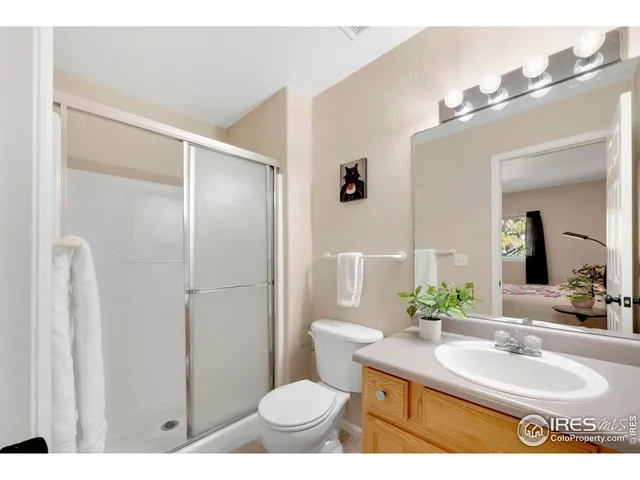 a bathroom with a sink toilet a shower and a mirror