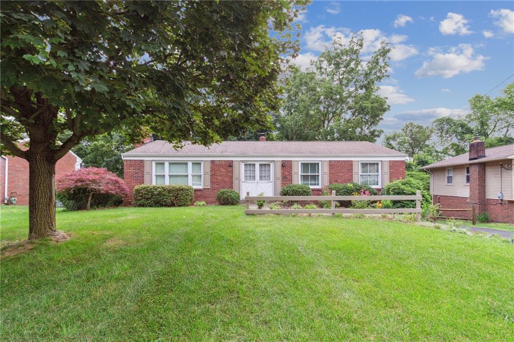 211 Wyngate Road Coraopolis, PA 15108 - Photo 1 of 31 a front view of a house with yard patio and green space