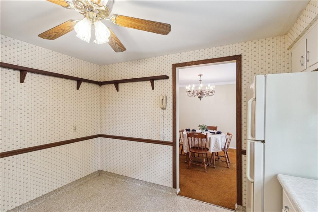 211 Wyngate Road Coraopolis, PA 15108 - Photo 12 of 31 a view of dining room with a hallway