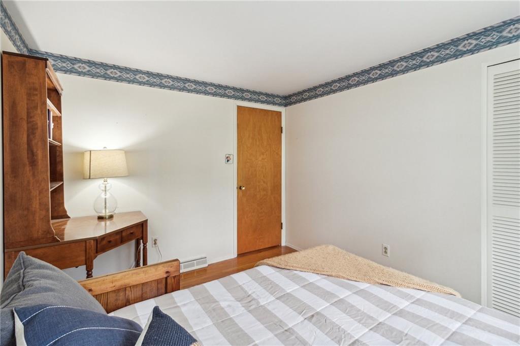 211 Wyngate Road Coraopolis, PA 15108 - Photo 16 of 31 a bedroom with a bed and wooden floor