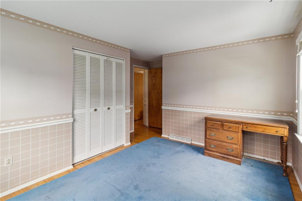 211 Wyngate Road Coraopolis, PA 15108 - Photo 21 of 31 an empty room with a fireplace and cabinet