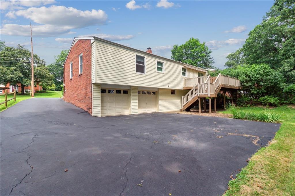 211 Wyngate Road Coraopolis, PA 15108 - Photo 28 of 31 a view of a house with a yard and a large tree