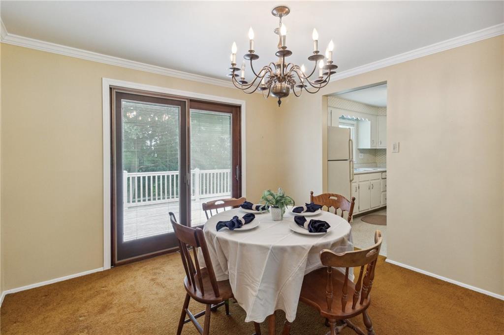 211 Wyngate Road Coraopolis, PA 15108 - Photo 9 of 31 a dining room with furniture and chandelier