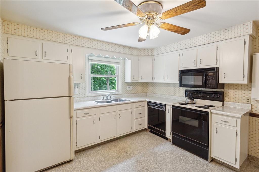 211 Wyngate Road Coraopolis, PA 15108 - Photo 10 of 31 a kitchen with white cabinets and white appliances