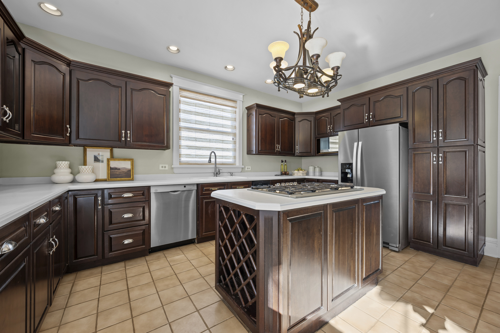 399 East Deerpath Road Lake Forest, IL 60045 - Photo 23 of 61 a kitchen with kitchen island granite countertop stainless steel appliances a sink stove refrigerator and cabinets