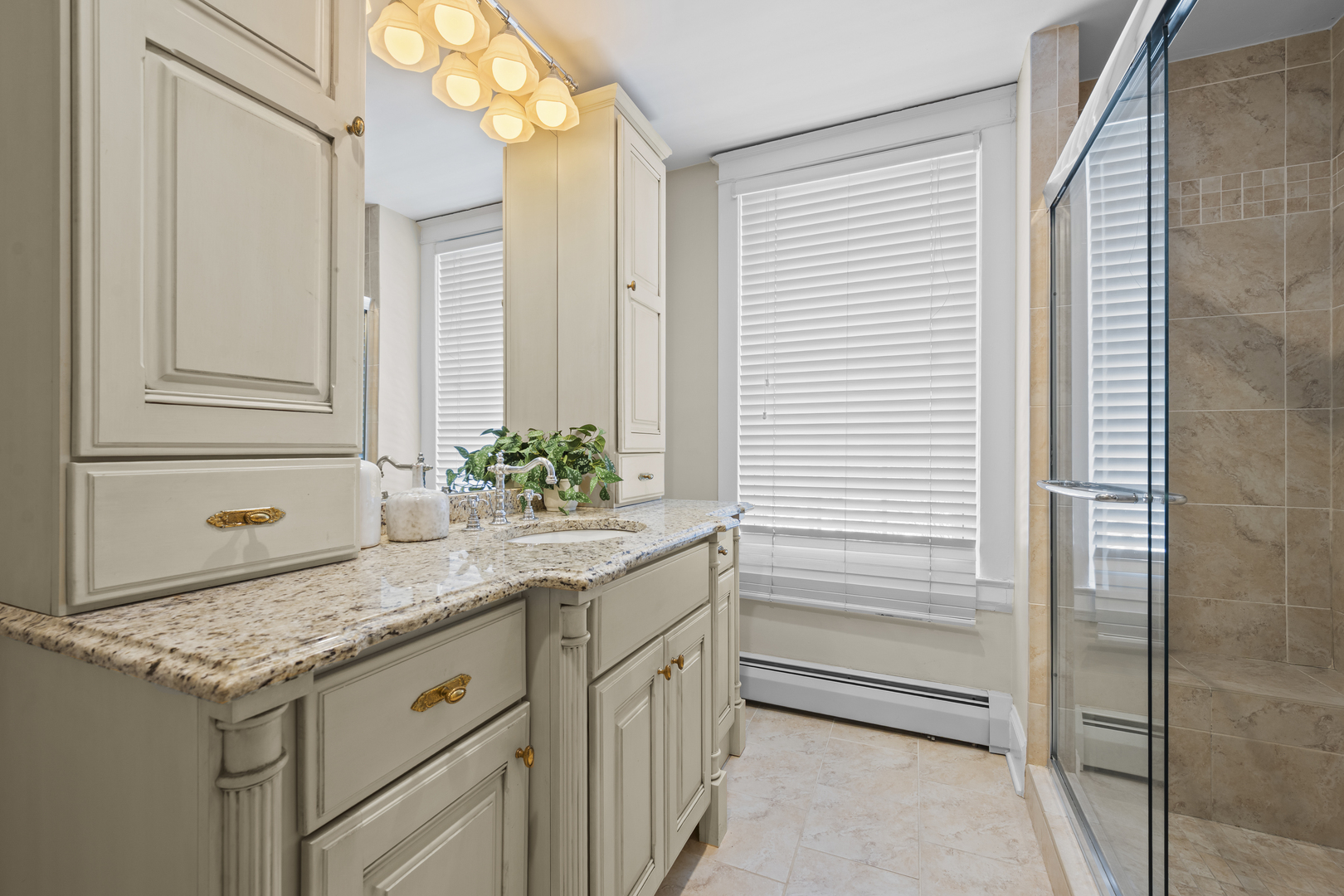 399 East Deerpath Road Lake Forest, IL 60045 - Photo 33 of 61 a bathroom with a granite countertop sink and a mirror