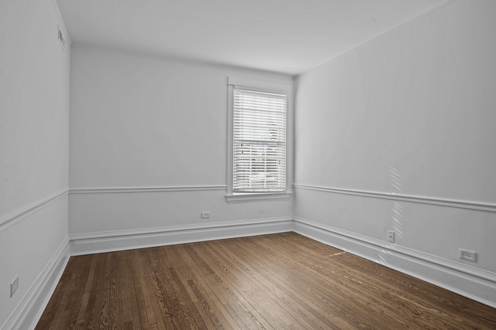 399 East Deerpath Road Lake Forest, IL 60045 - Photo 37 of 61 a view of an empty room with wooden floor and window