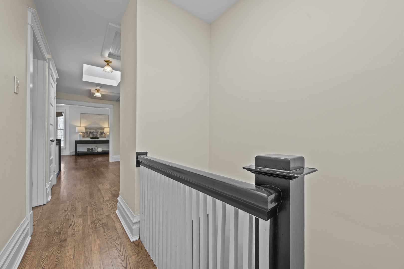 399 East Deerpath Road Lake Forest, IL 60045 - Photo 49 of 61 a view of a hallway with wooden floor and a bathroom