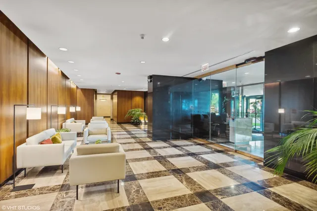 a lobby with furniture and window