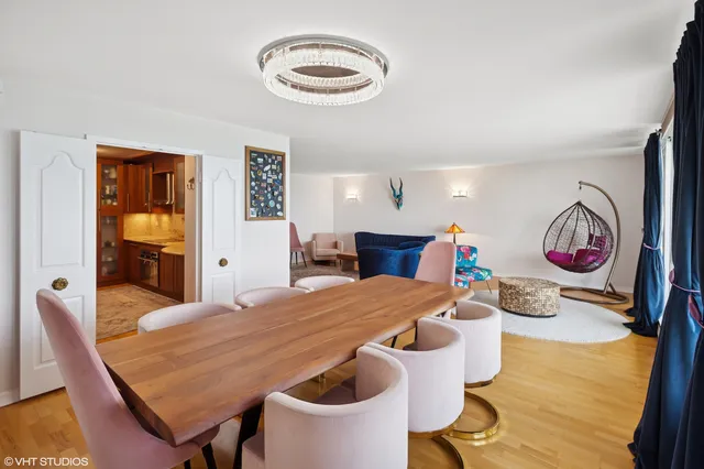a very nice looking dining room with a table and chairs