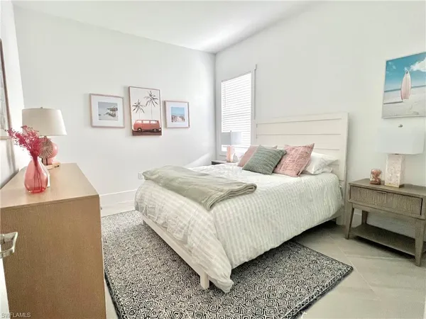 a bedroom with a bed and a desk