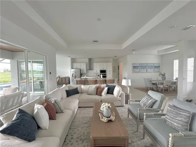 a living room with furniture or couch and a large window