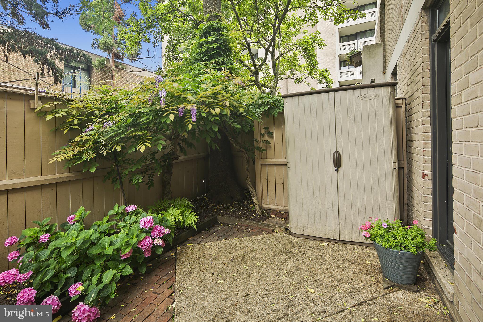 361 N Street Southwest, Unit 361 Washington, DC 20024 - Photo 16 of 27 Front Patio showcases beautiful garden