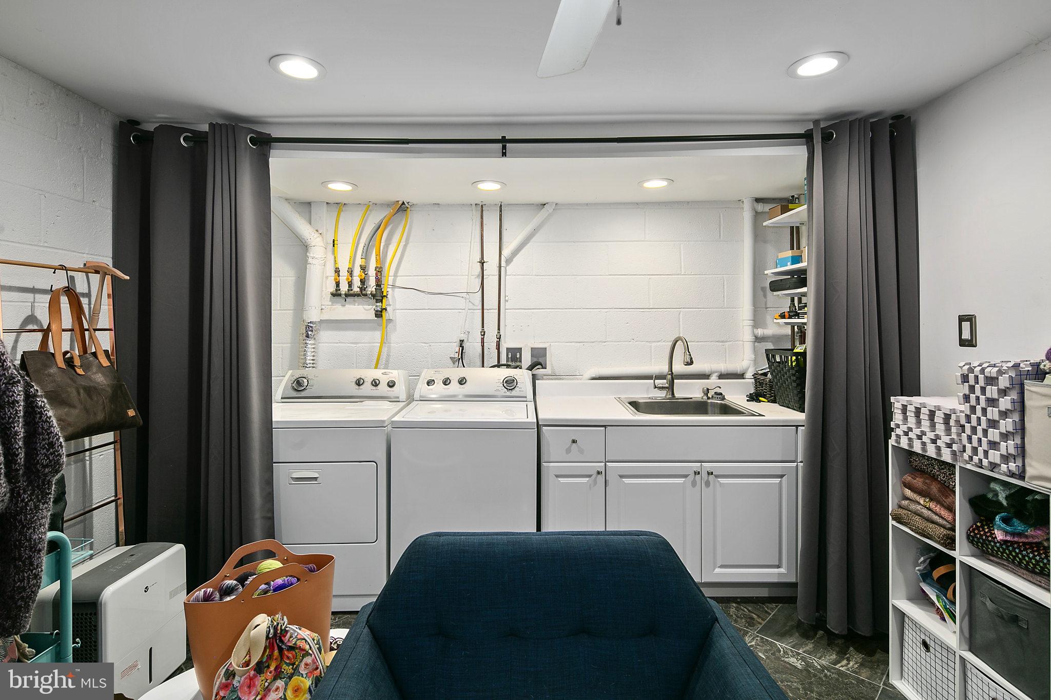 361 N Street Southwest, Unit 361 Washington, DC 20024 - Photo 34 of 52 Laundry with wash sink and storage