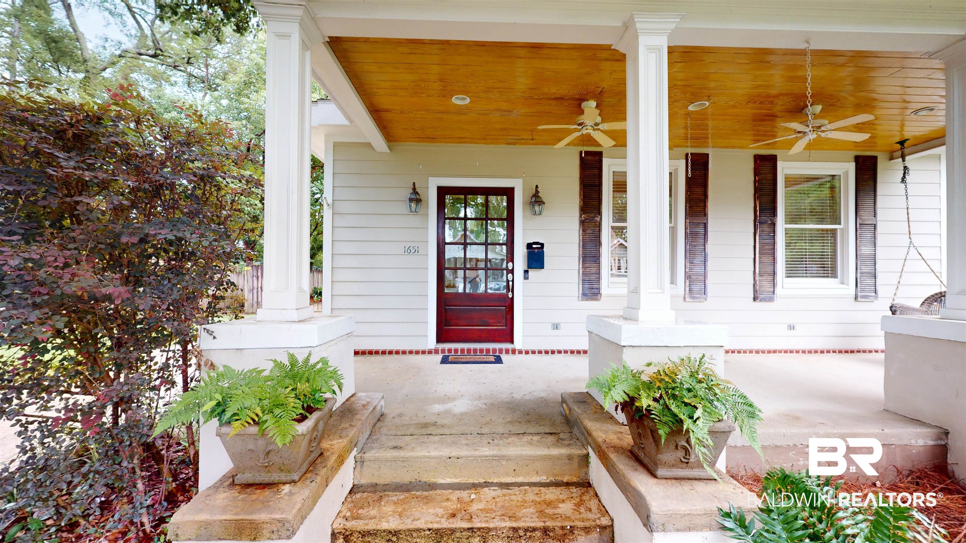 1651 Laurel Street Mobile, AL 36604 - Photo 2 of 28 View of exterior entry with a porch and ceiling fan