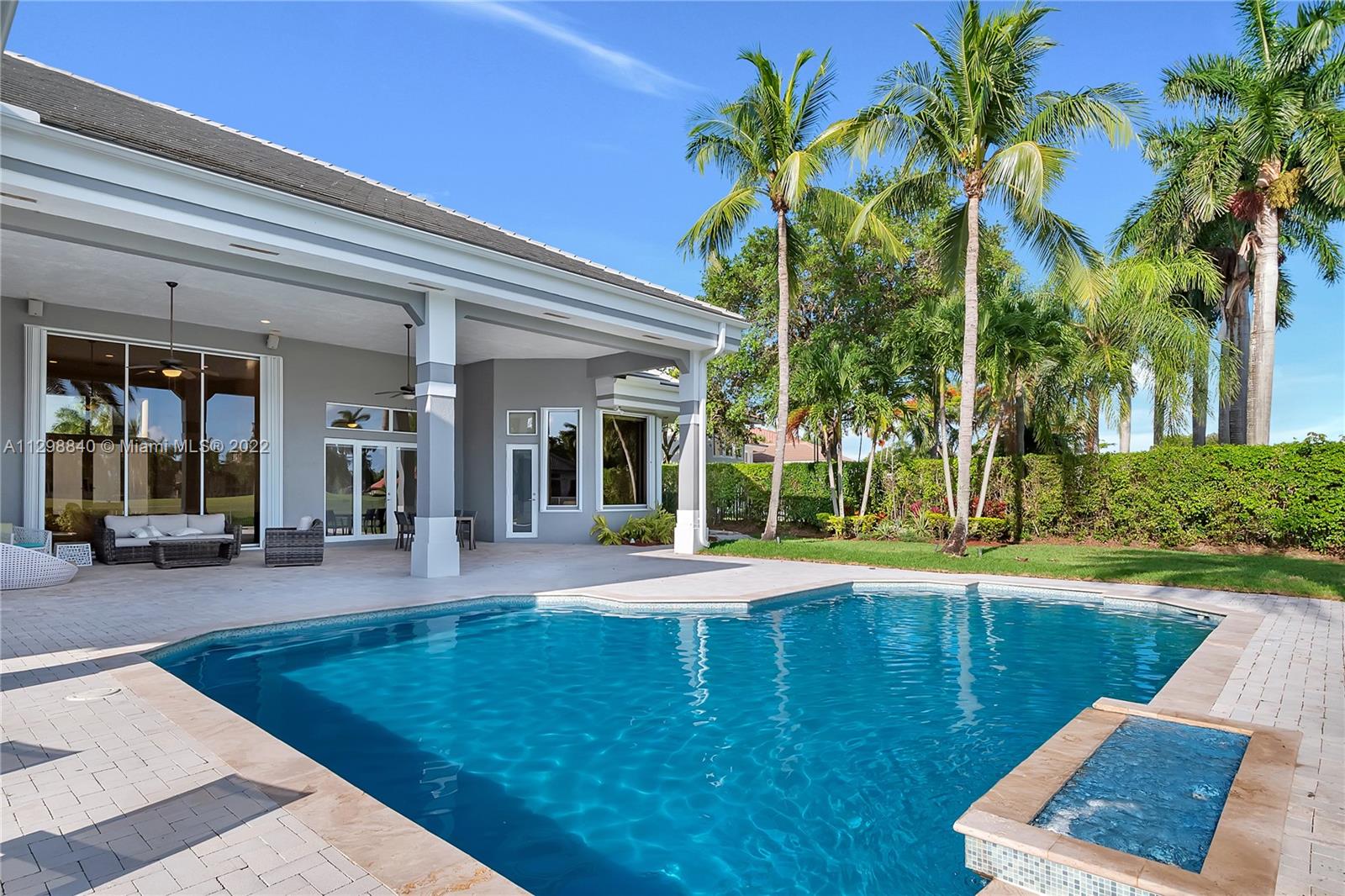 3088 Birkdale Drive Weston, FL 33332 - Photo 37 of 51 a view of a house with swimming pool and sitting area