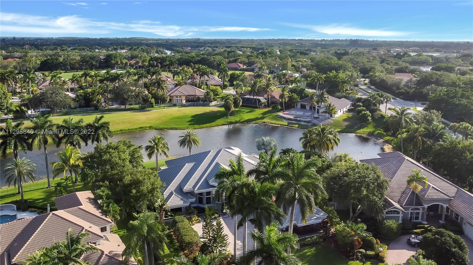 3088 Birkdale Drive Weston, FL 33332 - Photo 44 of 51 an aerial view of a city with lots of residential buildings ocean and mountain view in back