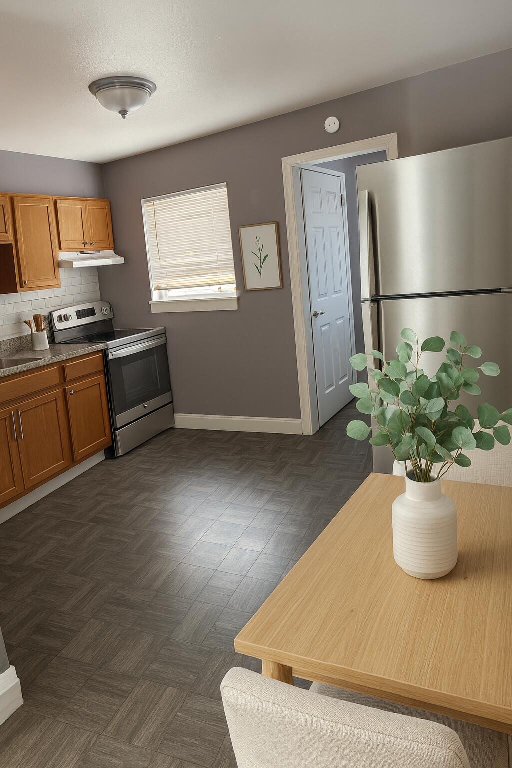 451 Silver Beach Road, Unit 1 Riviera Beach, FL 33403 - Photo 11 of 31 a view of kitchen with furniture and a potted plant