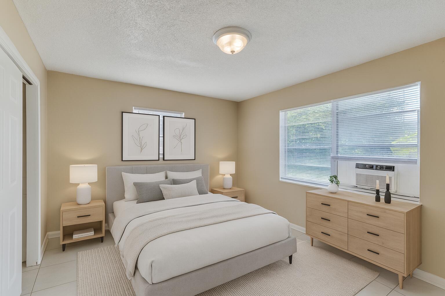 451 Silver Beach Road, Unit 1 Riviera Beach, FL 33403 - Photo 14 of 31 a bedroom with a bed and a window