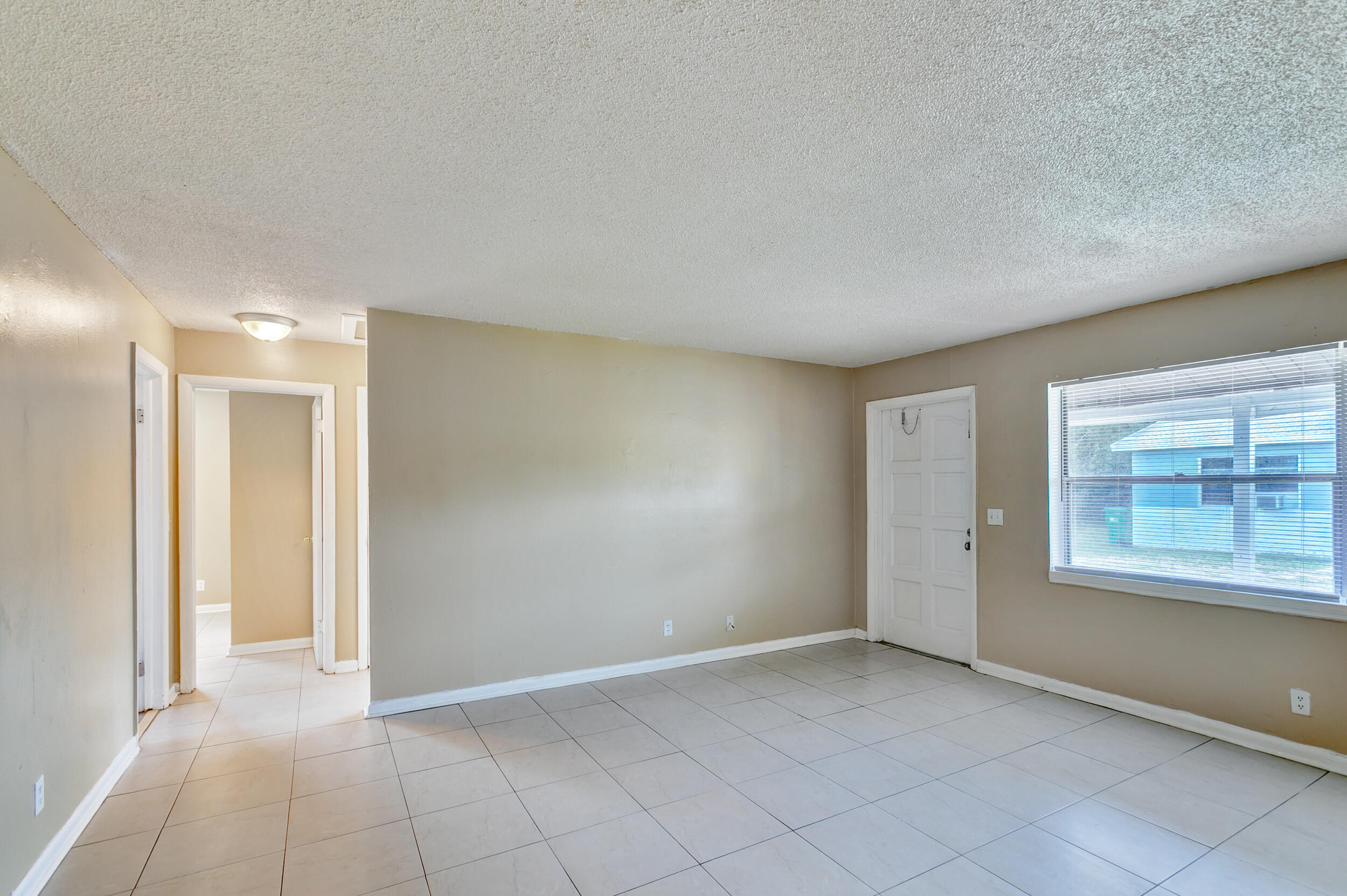 451 Silver Beach Road, Unit 1 Riviera Beach, FL 33403 - Photo 15 of 29 a view of an empty room with a window