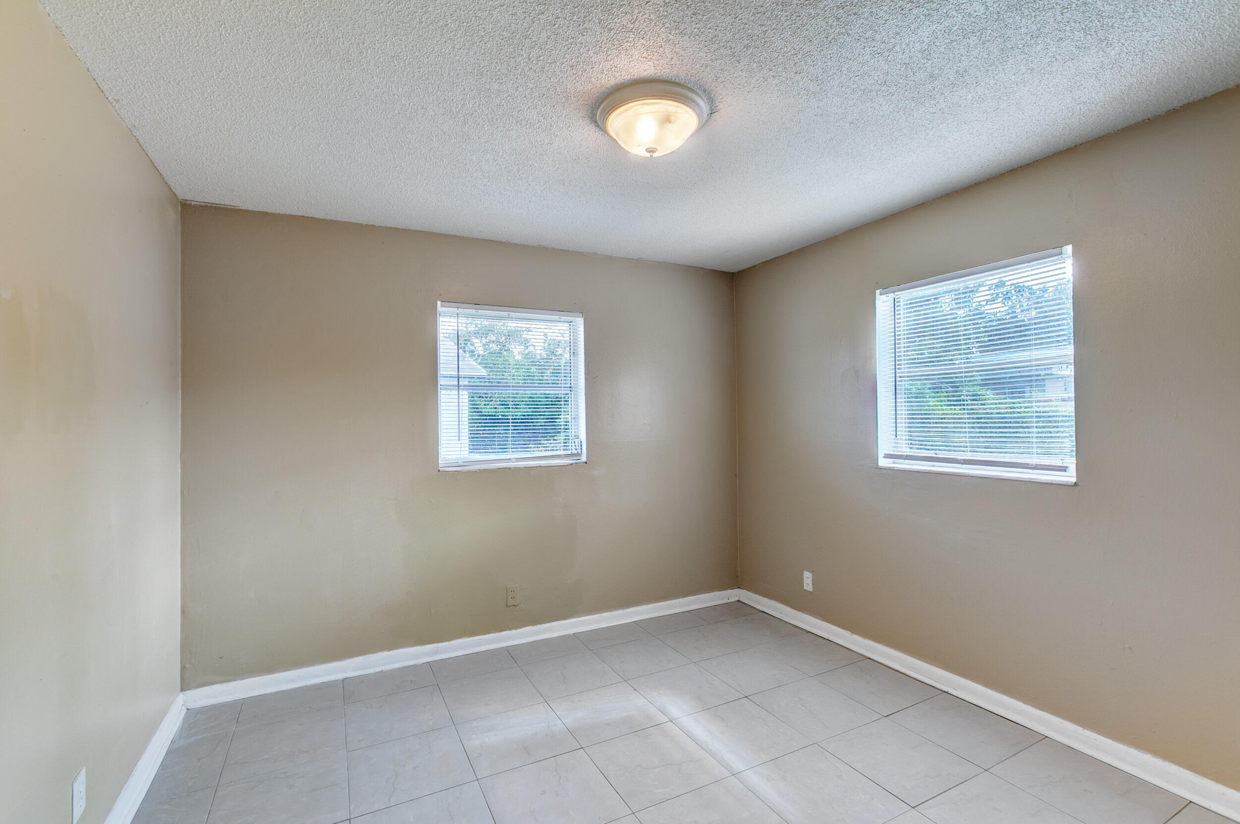 451 Silver Beach Road, Unit 1 Riviera Beach, FL 33403 - Photo 20 of 29 an empty room with a window