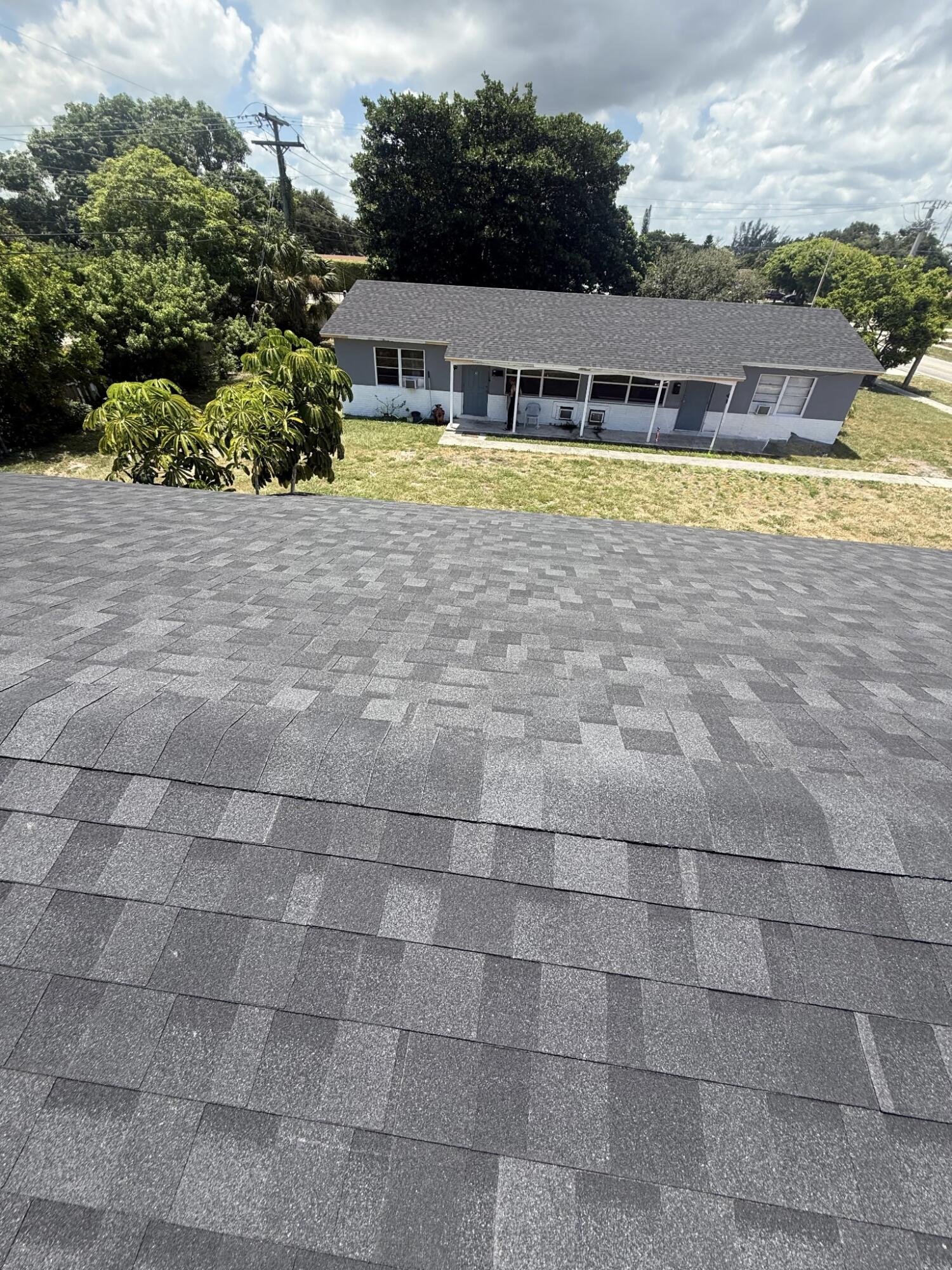 451 Silver Beach Road, Unit 1 Riviera Beach, FL 33403 - Photo 3 of 29 a view of swimming pool with outdoor seating and yard in back