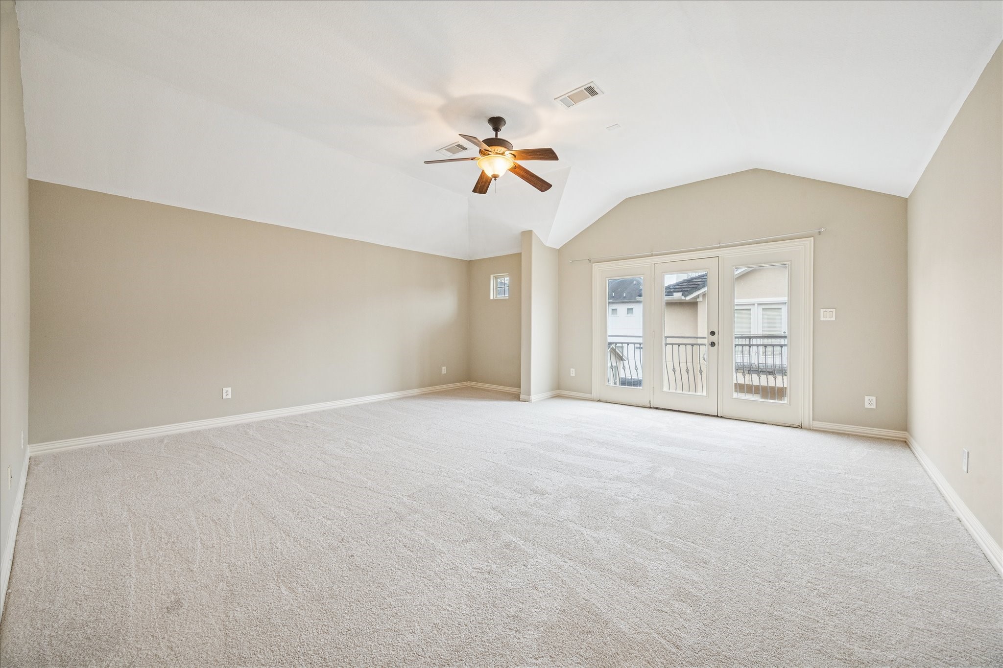 2 Schwab Lane Houston, TX 77055 - Photo 16 of 27 an empty room with chandelier fan and windows