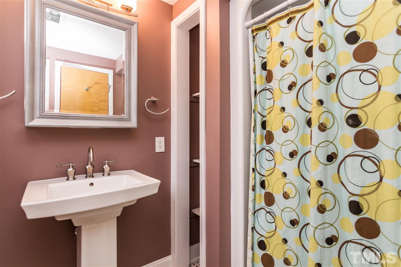 107 King William Road Raleigh, NC 27610 - Photo 15 of 25 a bathroom with a sink and a mirror