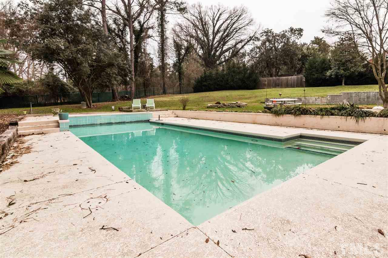107 King William Road Raleigh, NC 27610 - Photo 24 of 25 a view of a swimming pool with a yard
