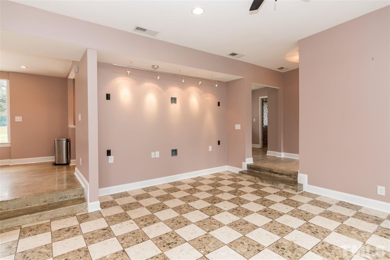 107 King William Road Raleigh, NC 27610 - Photo 7 of 25 a view of a bathroom with a shower and a sink