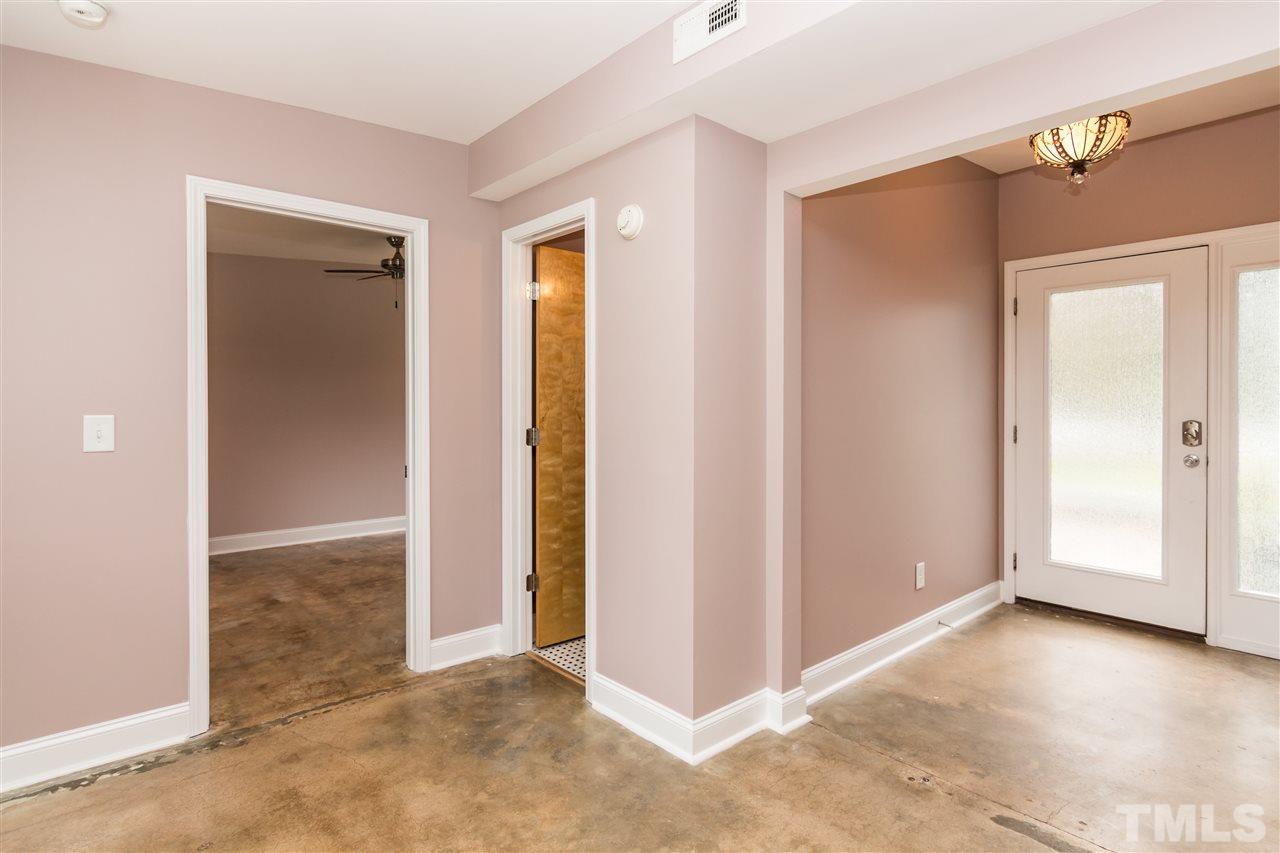 107 King William Road Raleigh, NC 27610 - Photo 8 of 25 an empty room with closet and windows