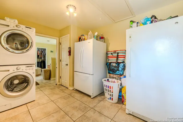 a view of a chairs and table in the patio