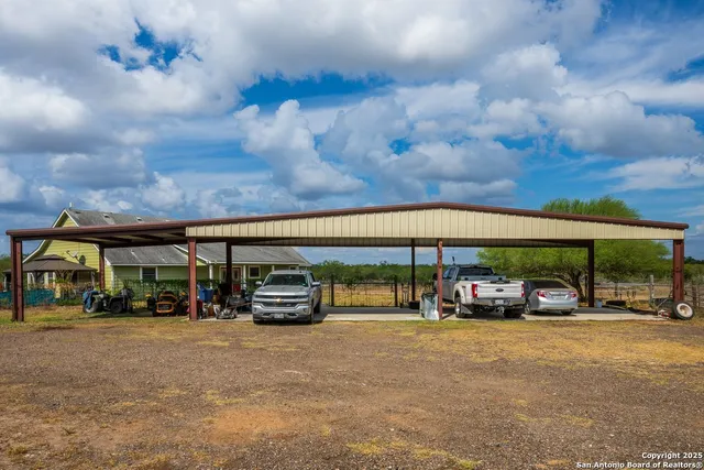 a view of a house with a back yard