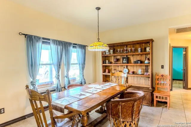 a kitchen with stainless steel appliances kitchen island granite countertop a sink and cabinets