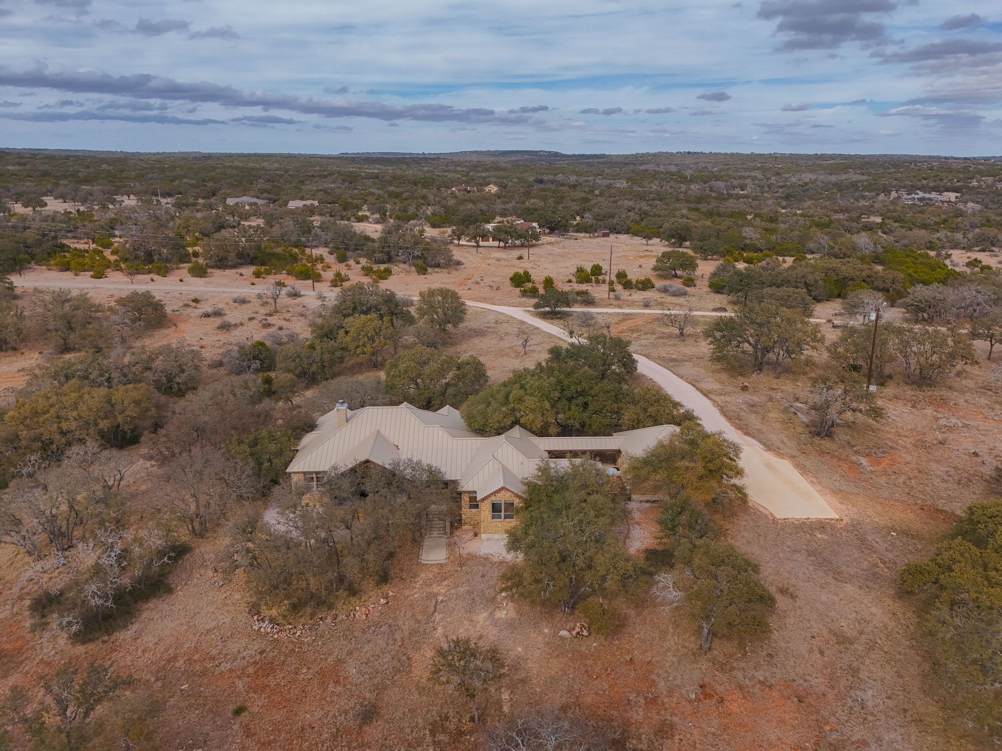 2551 Wolf Creek Ranch Road Burnet, TX 78611 - Photo 34 of 40 Aerial overview of property's location with a desert landscape and rural landscape