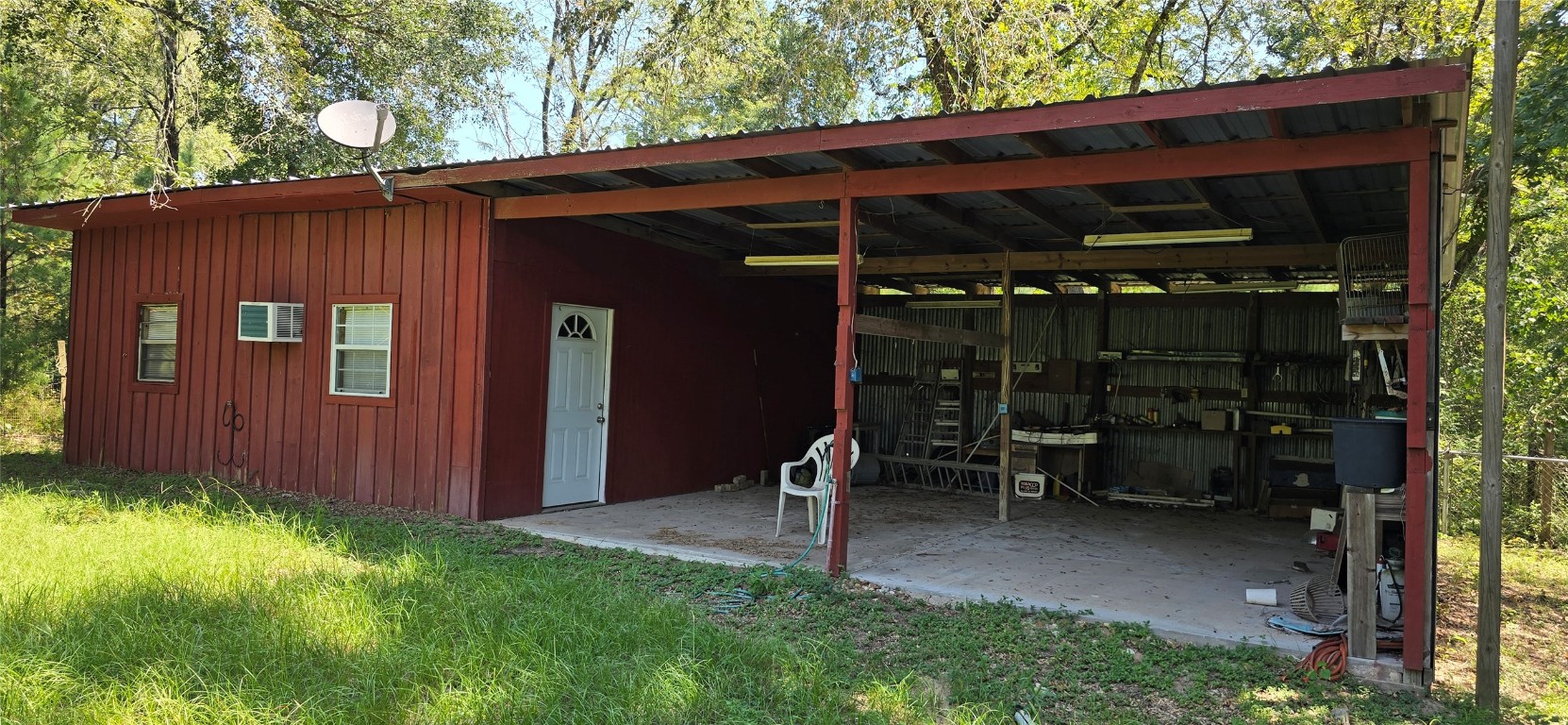 22868 Henson Road Montgomery, TX 77356 - Photo 5 of 9 a backyard of a house with barbeque oven table and chairs