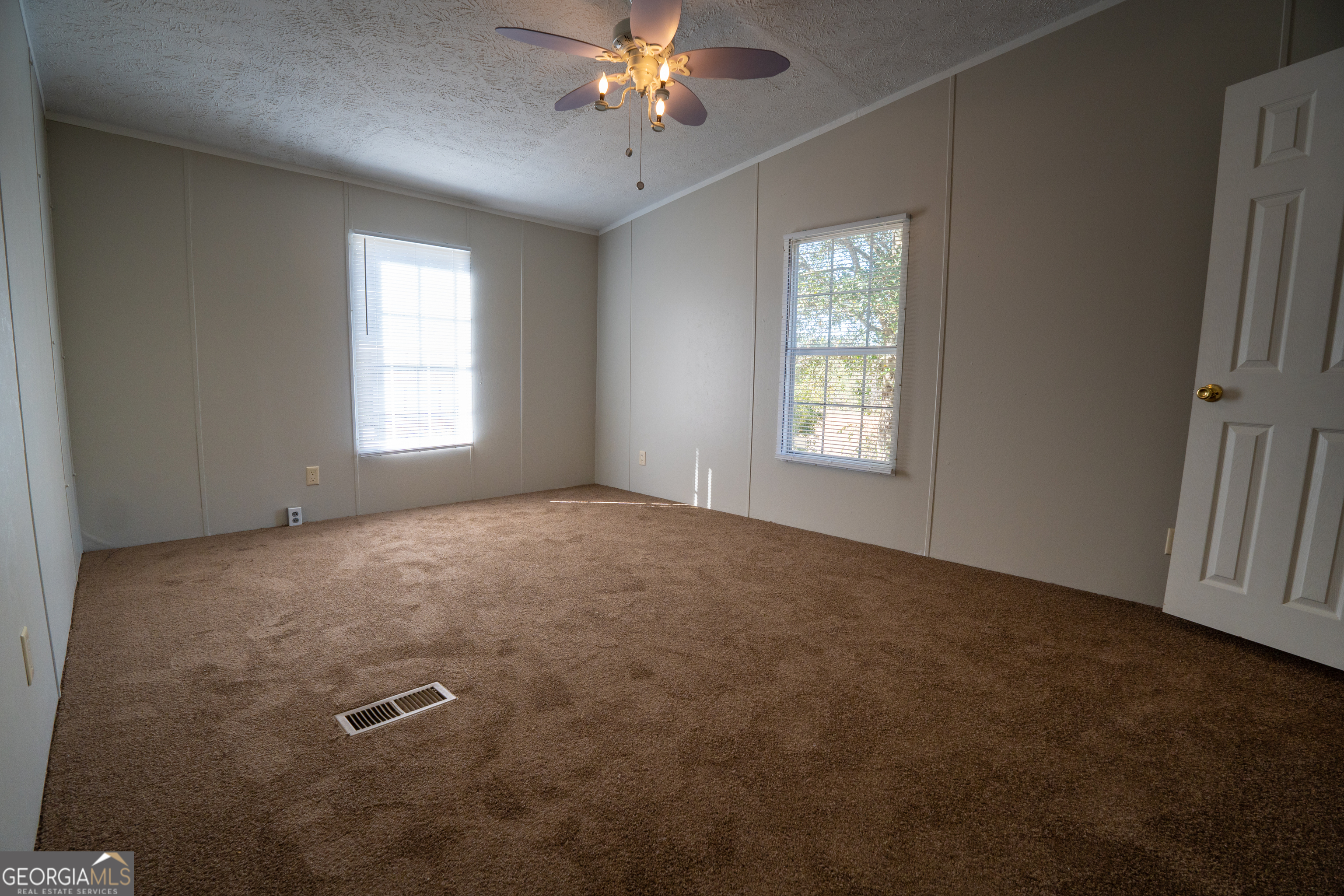 1100 Sapp Road Dry Branch, GA 31020 - Photo 19 of 54 a view of empty room with windows