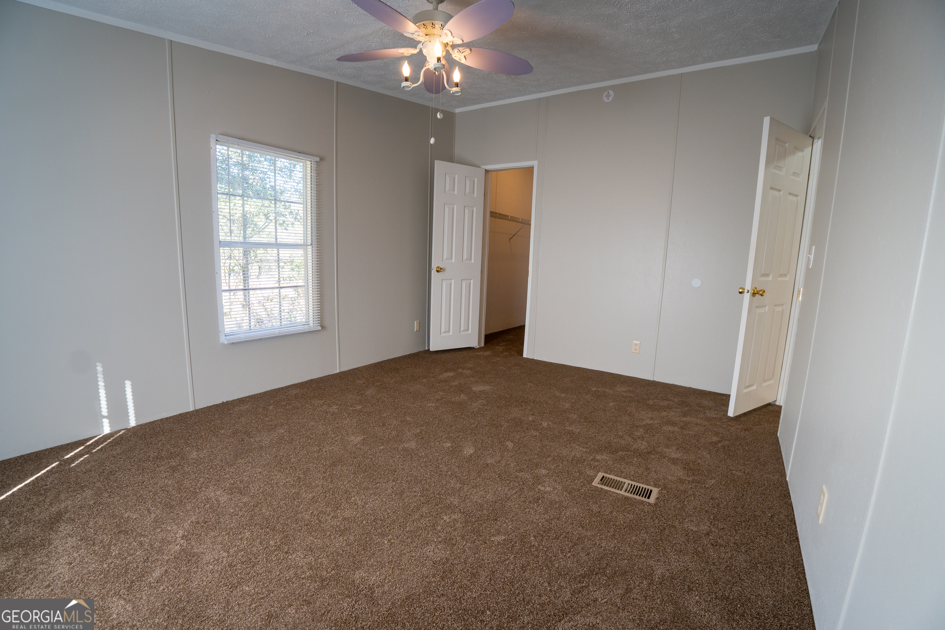 1100 Sapp Road Dry Branch, GA 31020 - Photo 20 of 54 a view of an empty room with a window