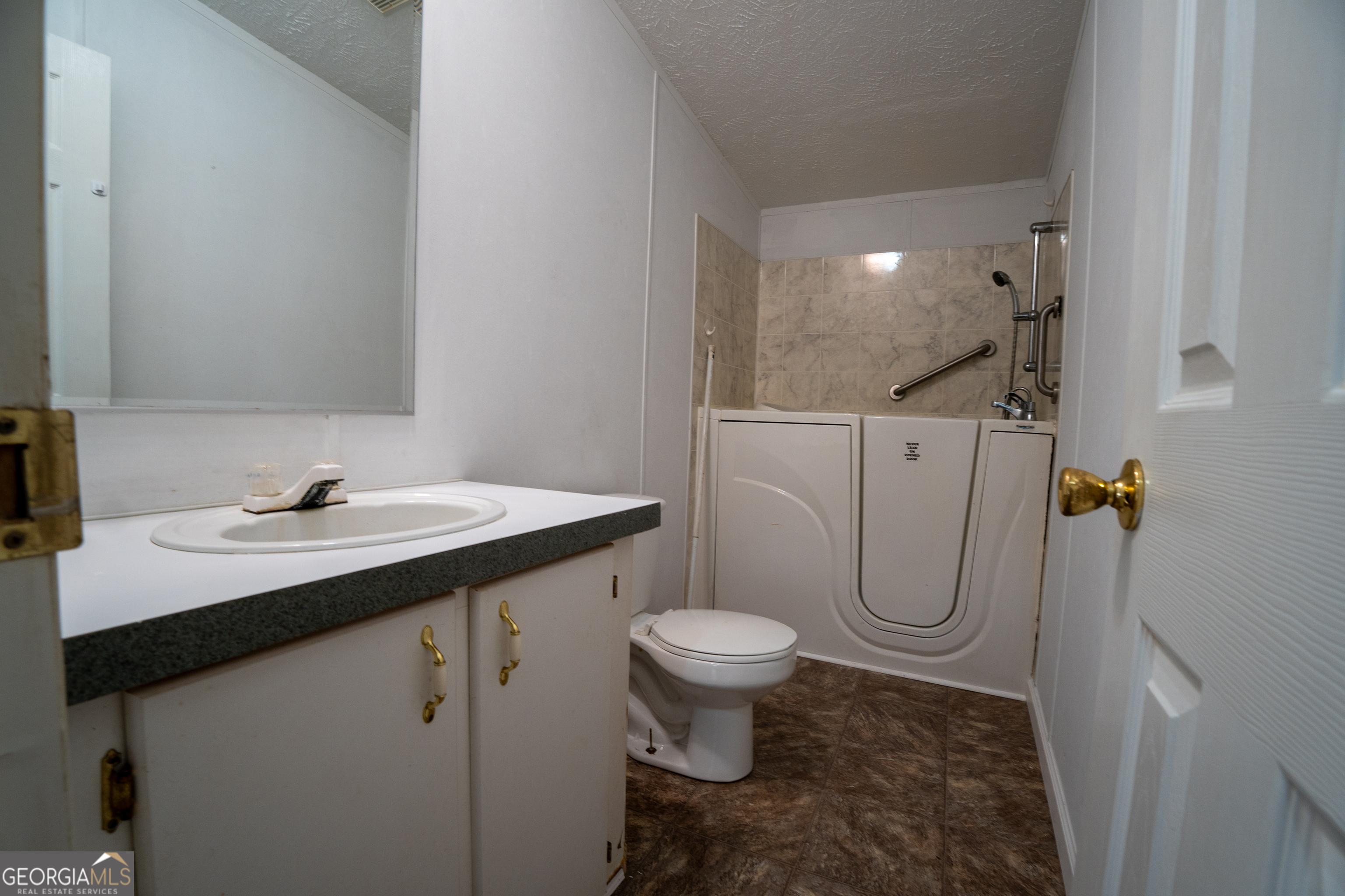 1100 Sapp Road Dry Branch, GA 31020 - Photo 22 of 54 a bathroom with a sink toilet and shower